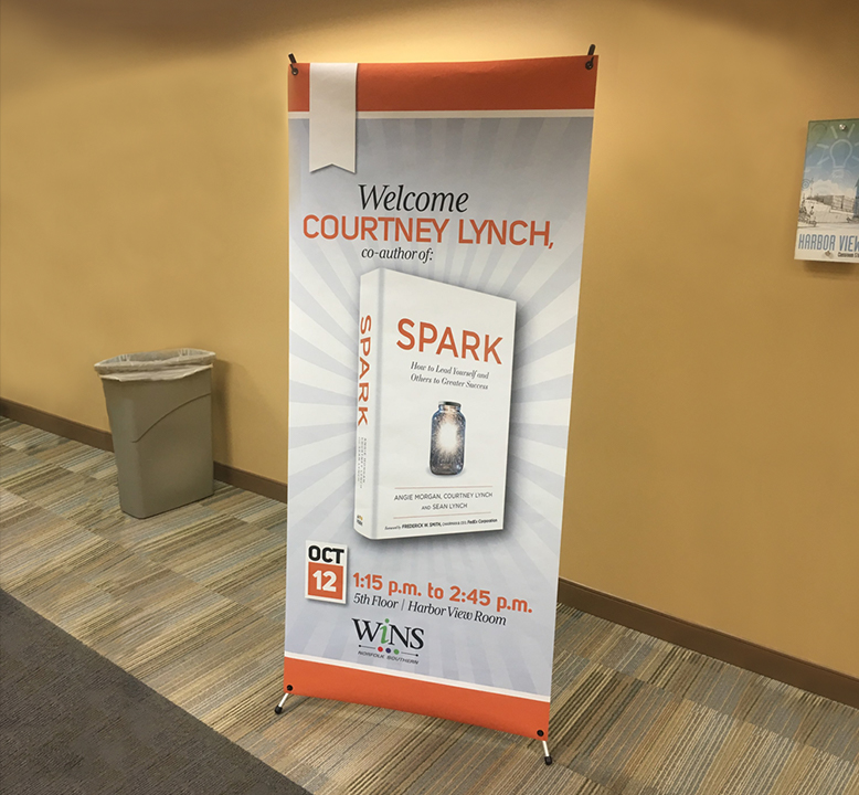 A welcome banner for Courtney Lynch, co-author of SPARK